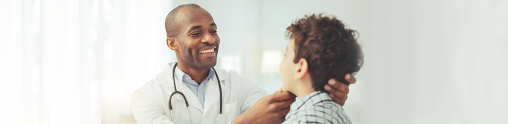 Provider evaluates a child | What is direct healthcare? | Premise Health Blog